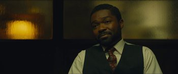 Movie still from “A Most Violent Year” (2014), directed by J.C. Chandor – A man wearing a vest and a neck tie; Close Up shot, Over the shoulder angle