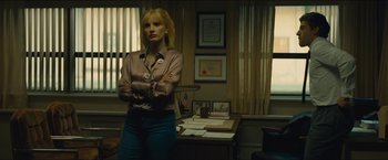 Movie still from “A Most Violent Year” (2014), directed by J.C. Chandor – A woman standing in front of a desk in an office; Medium shot, Low angle