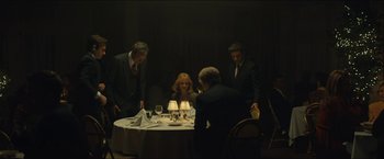 Movie still from “A Most Violent Year” (2014), directed by J.C. Chandor – A group of people standing around a table; Wide shot, Over the shoulder angle