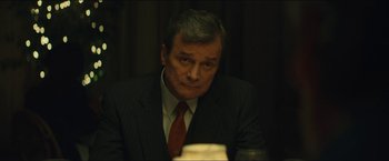 Movie still from “A Most Violent Year” (2014), directed by J.C. Chandor – A person wearing a suit and tie; Close Up shot, Over the shoulder angle