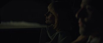 Movie still from “A Most Violent Year” (2014), directed by J.C. Chandor – A woman sitting in a car at night looking out the window; Close Up shot, Over the shoulder angle