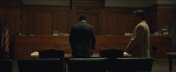 Movie still from “A Most Violent Year” (2014), directed by J.C. Chandor – A man standing in front of a judge's bench; Wide shot, Low angle