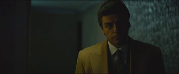 Movie still from “A Most Violent Year” (2014), directed by J.C. Chandor – A man wearing a suit and tie in a room; Close Up shot, Low angle