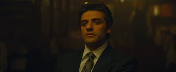 Movie still from “A Most Violent Year” (2014), directed by J.C. Chandor – A person wearing a suit and tie; Close Up shot, Low angle