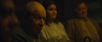Movie still from “A Most Violent Year” (2014), directed by J.C. Chandor – An older man and a younger woman sitting next to each other; Close Up shot, Over the shoulder angle