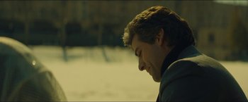 Movie still from “A Most Violent Year” (2014), directed by J.C. Chandor – A person with his head tilted down; Close Up shot, Over the shoulder angle