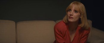 Movie still from “A Most Violent Year” (2014), directed by J.C. Chandor – A woman sitting on a couch in front of a window; Close Up shot, Over the shoulder angle