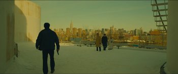 Movie still from “A Most Violent Year” (2014), directed by J.C. Chandor – A group of people standing on top of a snow covered field; Extreme Wide shot, Low angle
