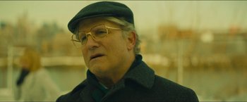 Movie still from “A Most Violent Year” (2014), directed by J.C. Chandor – An older man wearing glasses and a hat; Close Up shot, Over the shoulder angle