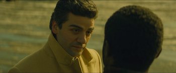 Movie still from “A Most Violent Year” (2014), directed by J.C. Chandor – A person wearing a yellow jacket; Close Up shot, Over the shoulder angle