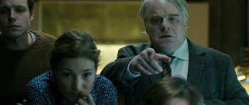 Movie still from “A Most Wanted Man” (2014), directed by Anton Corbijn – A man and a woman are sitting in front of each other; Close Up shot, Over the shoulder angle