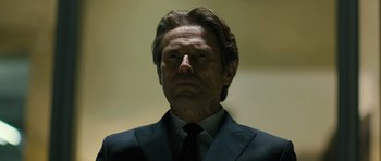 Movie still from “A Most Wanted Man” (2014), directed by Anton Corbijn – A person wearing a suit and tie; Close Up shot, Low angle