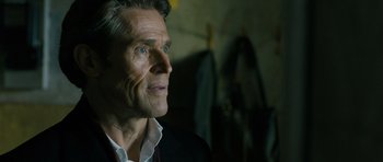 Movie still from “A Most Wanted Man” (2014), directed by Anton Corbijn – An older man looking up into the air; Close Up shot, Over the shoulder angle