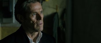 Movie still from “A Most Wanted Man” (2014), directed by Anton Corbijn – A person wearing a suit and tie; Close Up shot, Over the shoulder angle