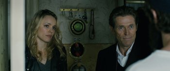 Movie still from “A Most Wanted Man” (2014), directed by Anton Corbijn – A man and a woman standing next to each other in a room; Close Up shot, Over the shoulder angle