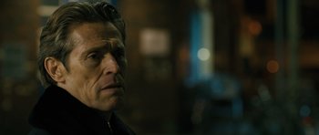 Movie still from “A Most Wanted Man” (2014), directed by Anton Corbijn – A person wearing a black jacket; Close Up shot, Over the shoulder angle