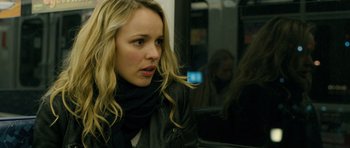 Movie still from “A Most Wanted Man” (2014), directed by Anton Corbijn – A woman sitting on a train looking out the train window; Close Up shot, Over the shoulder angle