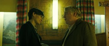 Movie still from “A Most Wanted Man” (2014), directed by Anton Corbijn – A man and a woman talking to each other; Medium shot, Over the shoulder angle