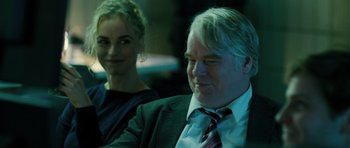 Movie still from “A Most Wanted Man” (2014), directed by Anton Corbijn – A man and a woman sitting next to each other; Close Up shot, Over the shoulder angle