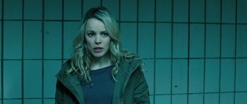 Movie still from “A Most Wanted Man” (2014), directed by Anton Corbijn – A woman with blonde hair wearing a green jacket; Close Up shot, Over the shoulder angle