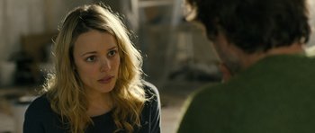 Movie still from “A Most Wanted Man” (2014), directed by Anton Corbijn – A young woman sitting in front of a young man; Close Up shot, Over the shoulder angle