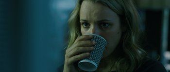 Movie still from “A Most Wanted Man” (2014), directed by Anton Corbijn – A person drinking a cup of coffee; Close Up shot, Over the shoulder angle