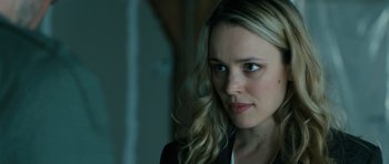 Movie still from “A Most Wanted Man” (2014), directed by Anton Corbijn – A person with long blonde hair; Close Up shot, Over the shoulder angle