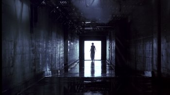 Movie still from “A Nightmare on Elm Street” (1984), directed by Wes Craven – A person is standing in a dark hallway; Extreme Wide shot, Low angle