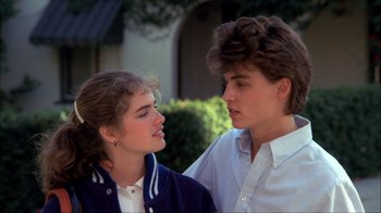 Movie still from “A Nightmare on Elm Street” (1984), directed by Wes Craven – A man and a woman standing next to each other; Close Up shot, Over the shoulder angle