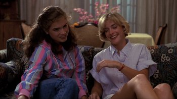 Movie still from “A Nightmare on Elm Street” (1984), directed by Wes Craven – Two women sitting on a couch talking to each other; Medium shot, Low angle
