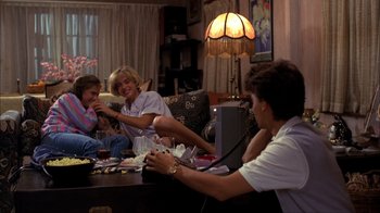 Movie still from “A Nightmare on Elm Street” (1984), directed by Wes Craven – A group of people sitting around a table; Medium shot, High angle