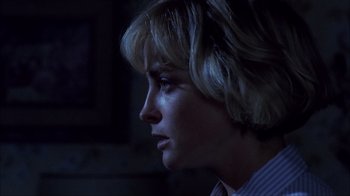 Movie still from “A Nightmare on Elm Street” (1984), directed by Wes Craven – A person with short blonde hair; Close Up shot, Over the shoulder angle
