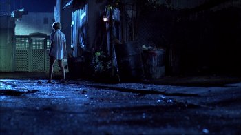 Movie still from “A Nightmare on Elm Street” (1984), directed by Wes Craven – A man walking down a street at night; Wide shot, Low angle
