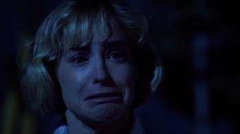 Movie still from “A Nightmare on Elm Street” (1984), directed by Wes Craven – A person with her eyes closed crying; Close Up shot, Low angle
