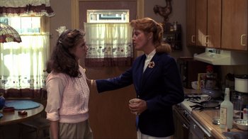 Movie still from “A Nightmare on Elm Street” (1984), directed by Wes Craven – Two women in a kitchen talking to each other; Medium shot, Over the shoulder angle