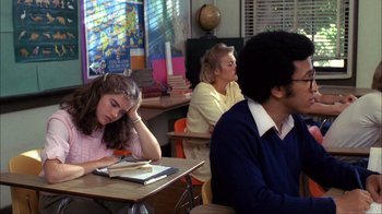Movie still from “A Nightmare on Elm Street” (1984), directed by Wes Craven – A group of people sitting at a table in a room; Medium shot, High angle