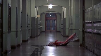 Movie still from “A Nightmare on Elm Street” (1984), directed by Wes Craven – An umbrella laying on the ground in a hallway; Wide shot, High angle