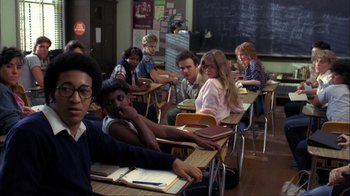 Movie still from “A Nightmare on Elm Street” (1984), directed by Wes Craven – A group of people sitting at desks in a classroom; Medium shot, High angle