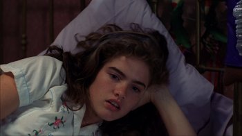Movie still from “A Nightmare on Elm Street” (1984), directed by Wes Craven – A woman laying in bed with her head resting on a pillow; Close Up shot, High angle