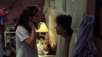 Movie still from “A Nightmare on Elm Street” (1984), directed by Wes Craven – A young girl and a young boy are looking at each other; Medium shot, Over the shoulder angle