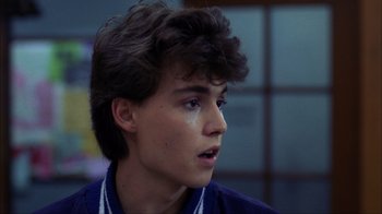 Movie still from “A Nightmare on Elm Street” (1984), directed by Wes Craven – A young man is looking into the distance; Close Up shot, Low angle