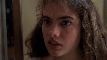 Movie still from “A Nightmare on Elm Street” (1984), directed by Wes Craven – A young girl's face with blue eyes; Close Up shot, Over the shoulder angle