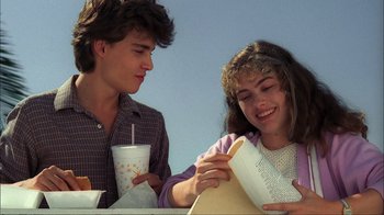Movie still from “A Nightmare on Elm Street” (1984), directed by Wes Craven – A man and a woman sitting next to each other at a table; Close Up shot, Over the shoulder angle