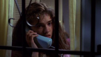 Movie still from “A Nightmare on Elm Street” (1984), directed by Wes Craven – A woman holding a phone up to her ear; Close Up shot, High angle