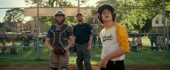 Movie still from “A Quiet Place Part II” (2020), directed by John Krasinski – A group of young men standing on top of a baseball field; Medium shot, Over the shoulder angle