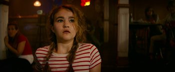 Movie still from “A Quiet Place Part II” (2020), directed by John Krasinski – A young woman with red and white striped shirt looking up; Close Up shot, Low angle