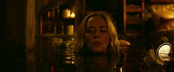 Movie still from “A Quiet Place Part II” (2020), directed by John Krasinski – A woman in the water with her eyes closed; Close Up shot, High angle