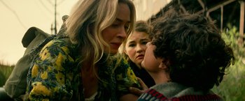 Movie still from “A Quiet Place Part II” (2020), directed by John Krasinski – A group of people that are standing around each other; Close Up shot, Over the shoulder angle