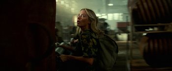 Movie still from “A Quiet Place Part II” (2020), directed by John Krasinski – A woman with a backpack riding a scooter; Medium shot, Low angle