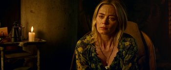 Movie still from “A Quiet Place Part II” (2020), directed by John Krasinski – A person wearing a yellow and black shirt; Close Up shot, Over the shoulder angle